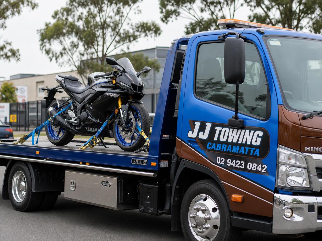 Motorbike strapped to a JJ Towing Cabramatta tow truck